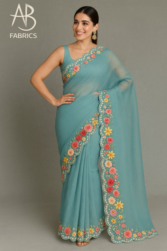 Elegant Teal Organza Saree with Floral French Knot Embroidery and Scalloped Border OFE01