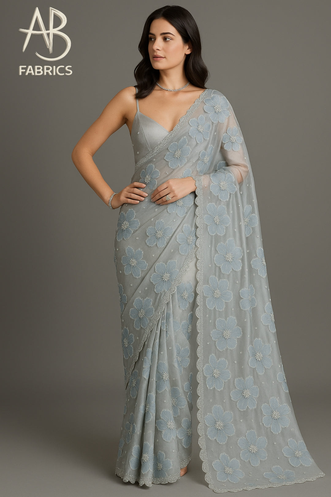 Graceful Powder Blue Floral Embroidered Organza Saree with Scalloped Border